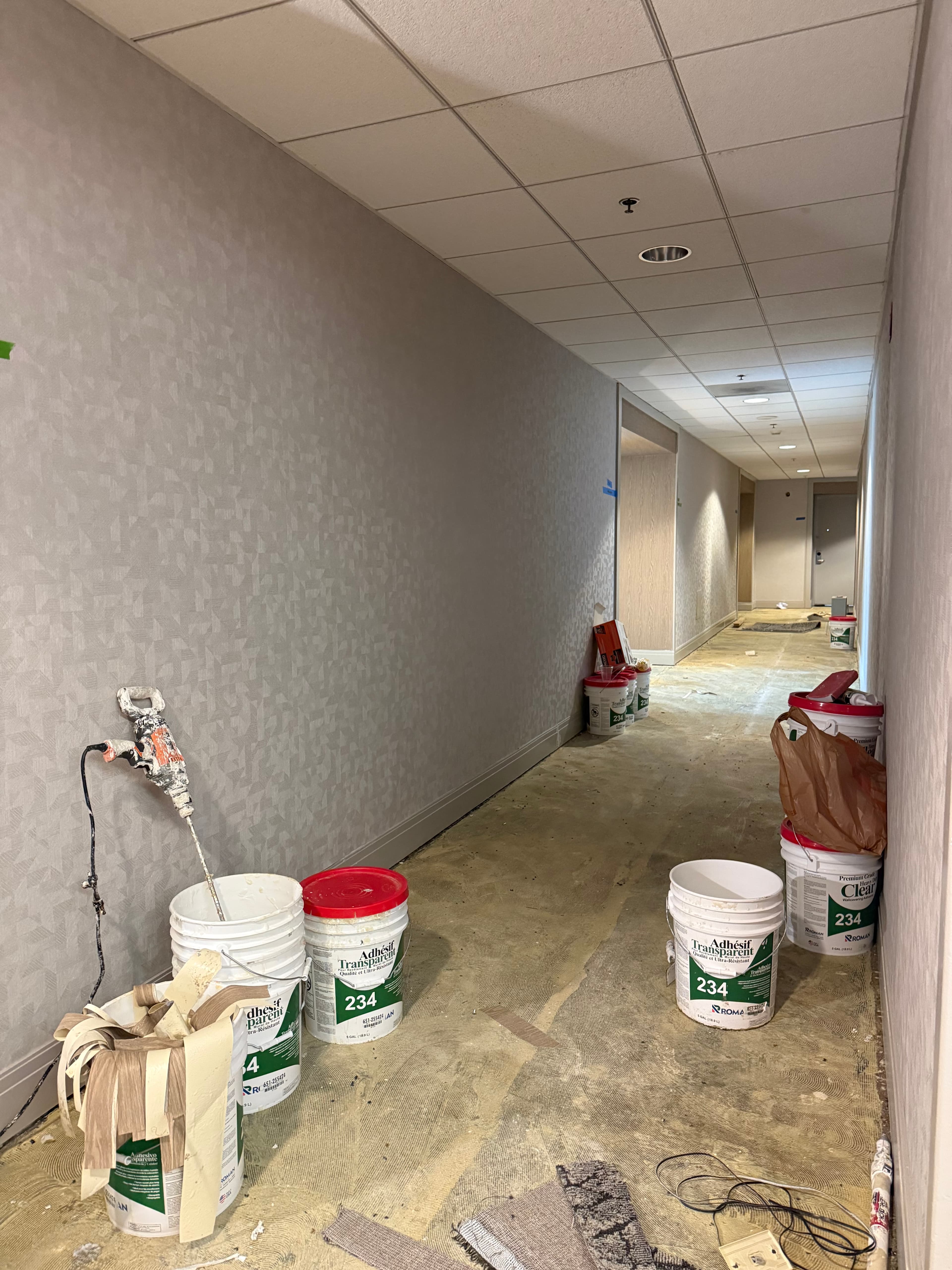 Hotel corridor during flooring adhesive prep