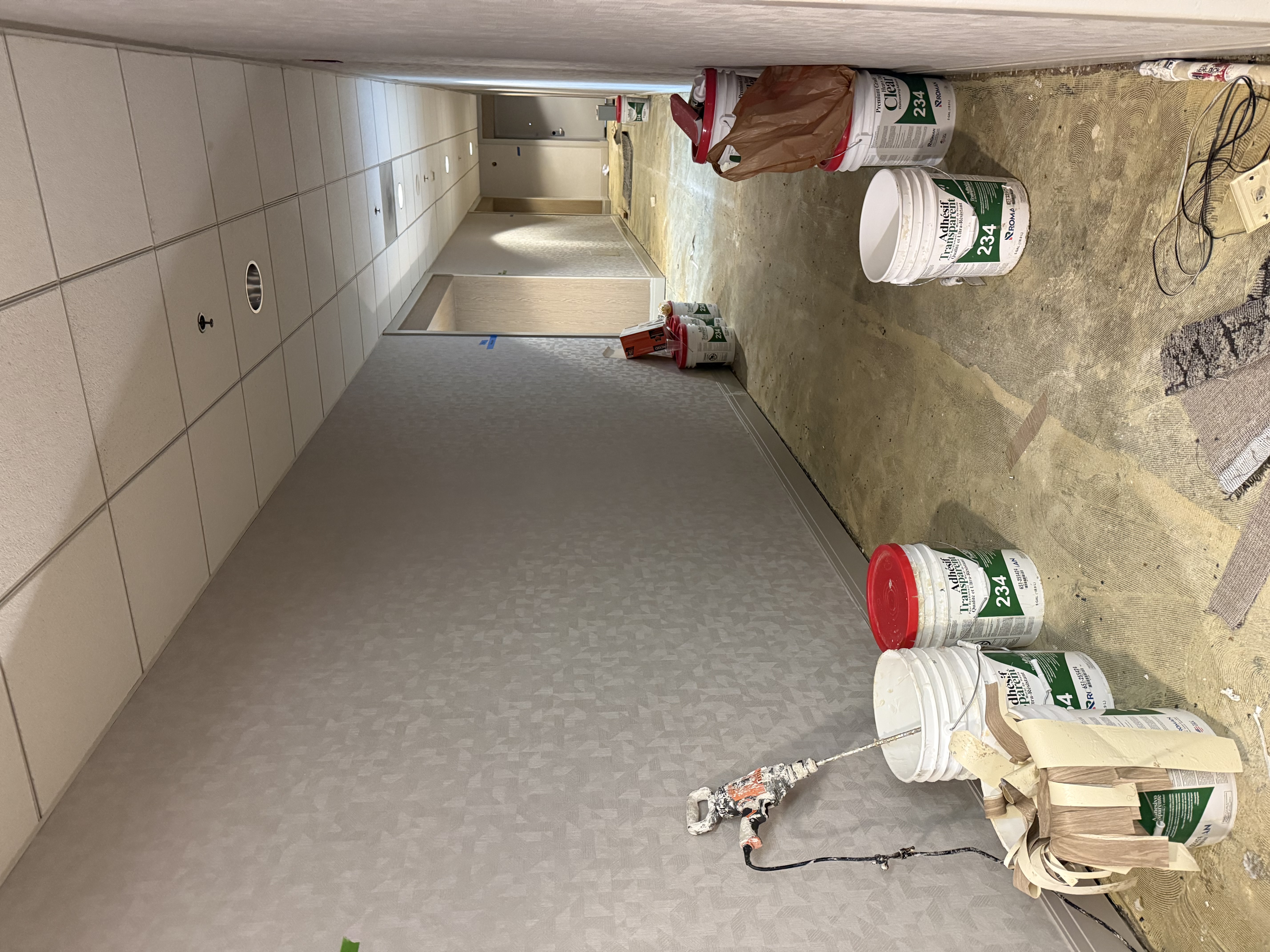 Hotel corridor during flooring adhesive prep